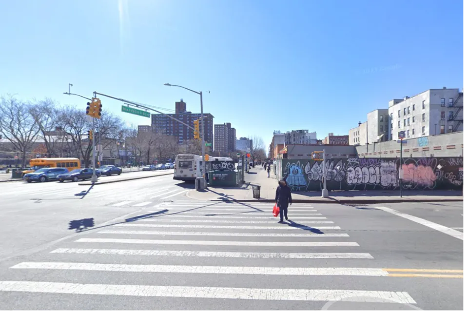 Google street view of New York City intersection with construction fence